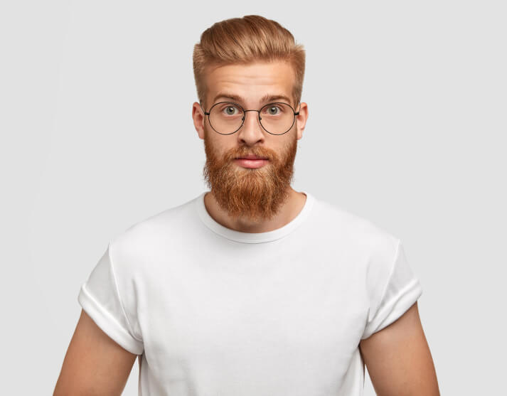 confident-ginger-man-with-trendy-hairstyle-wears-spectacles-looks-directly 1-1 confident-ginger-man-with-trendy-hairstyle-wears-spectacles-looks-directly 1-1
